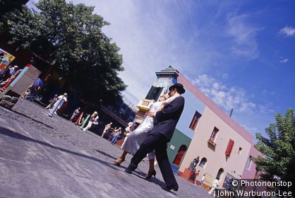 Argentina;Buenos Aires - Tango dancers in the colourful and popular area known as La Boca in Buenos Aires. La Boca (the Mouth), is located by the port.
