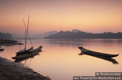 Boats on Mekong River at sunset, Luang Prabang, Laos