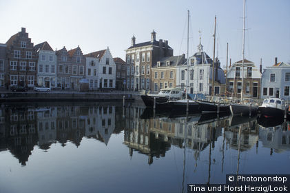 Sailing boats are moored at the deserted Goes harbour, Goes, Zeeland Province, Netherlands, Europe