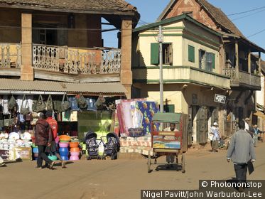 Ambalavao, Madagascar. A street in Ambalavao with it typical highland architecture. Rickshaws, known as pousse-pousses, are a common form of transport throughout southern Madagascar.