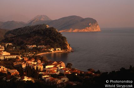 Adriatic coastal town with Dubovica hill in background. Petrovac, Montenegro