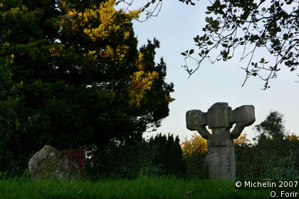 Round clock tower and cross
