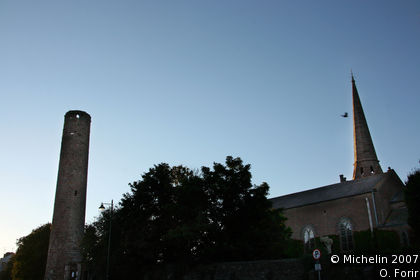 Round clock tower and cross
