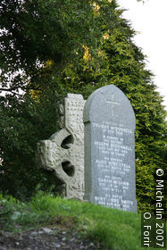 Round clock tower and cross